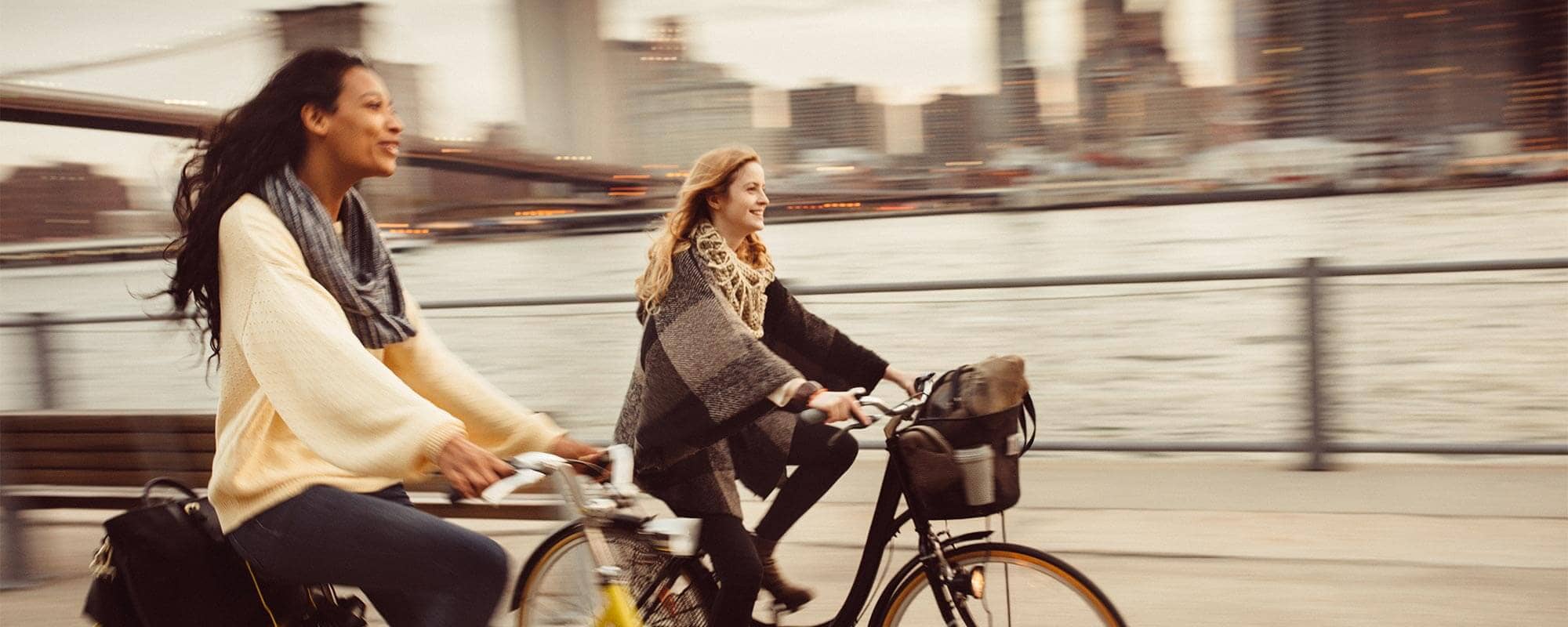 Travel nurses biking through the city