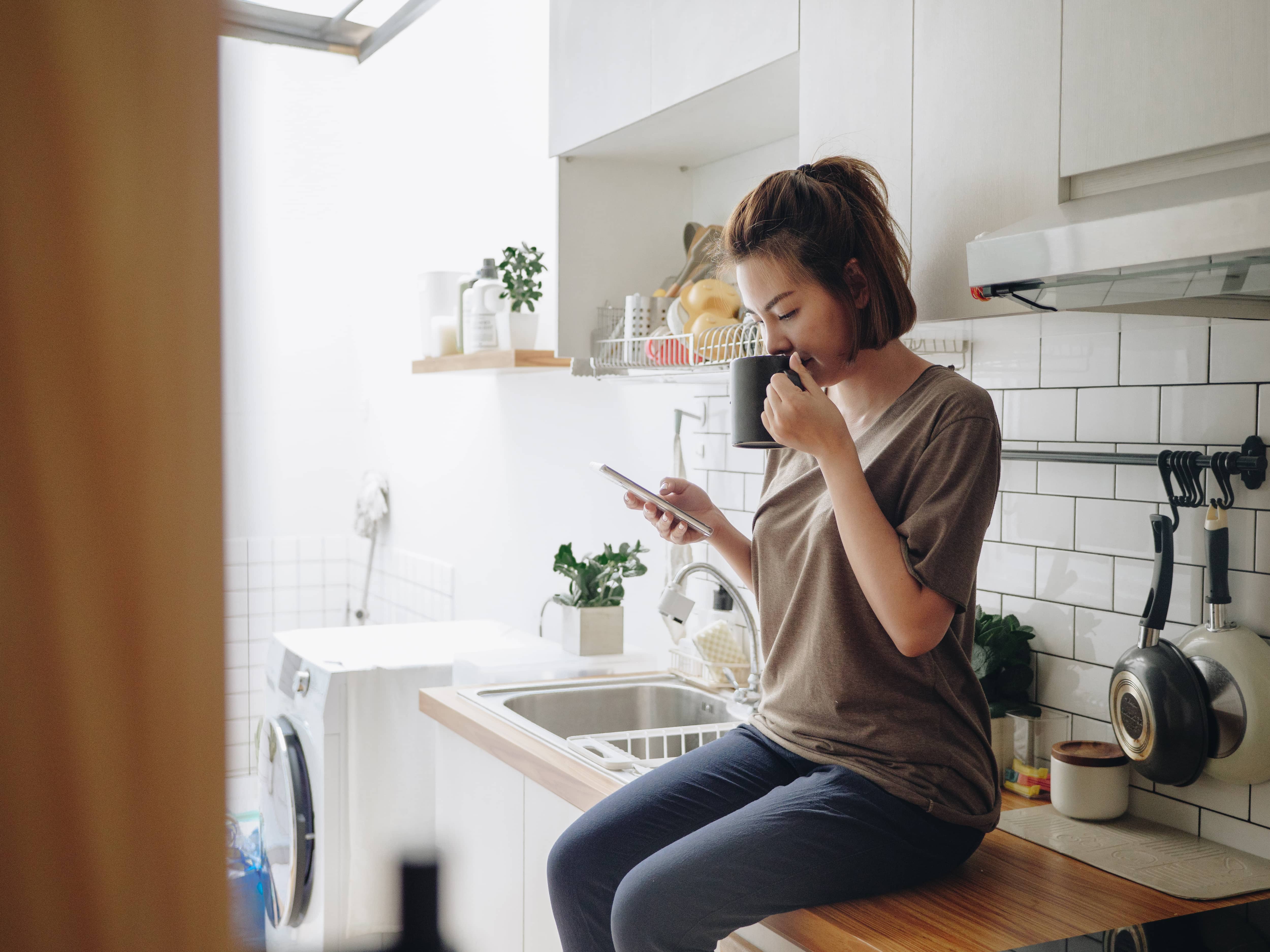 Woman sitting with cell phone Woman sitting with cell phone