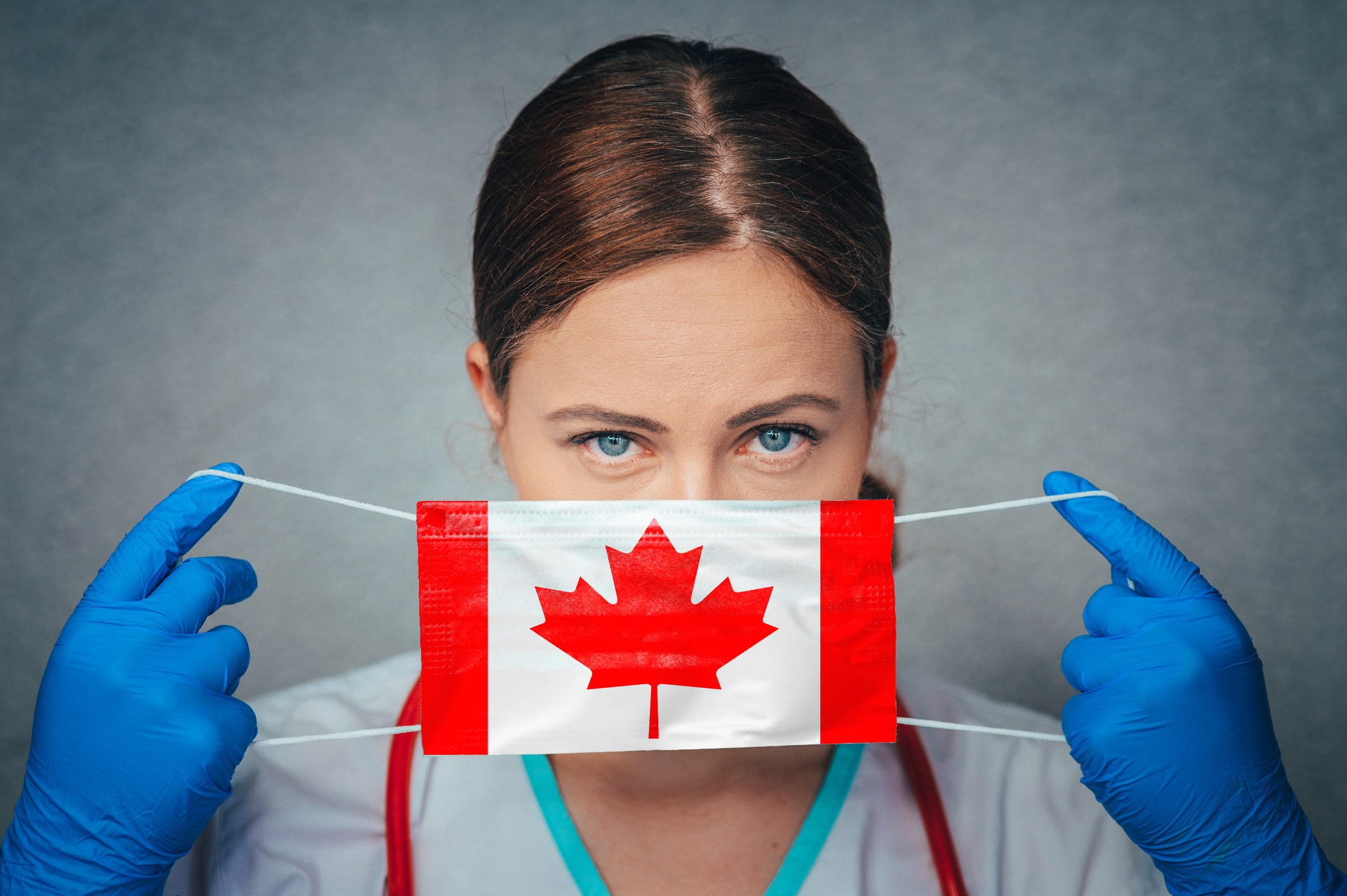 canadian travel nurse wears a face mask stamped with canada maple leaf