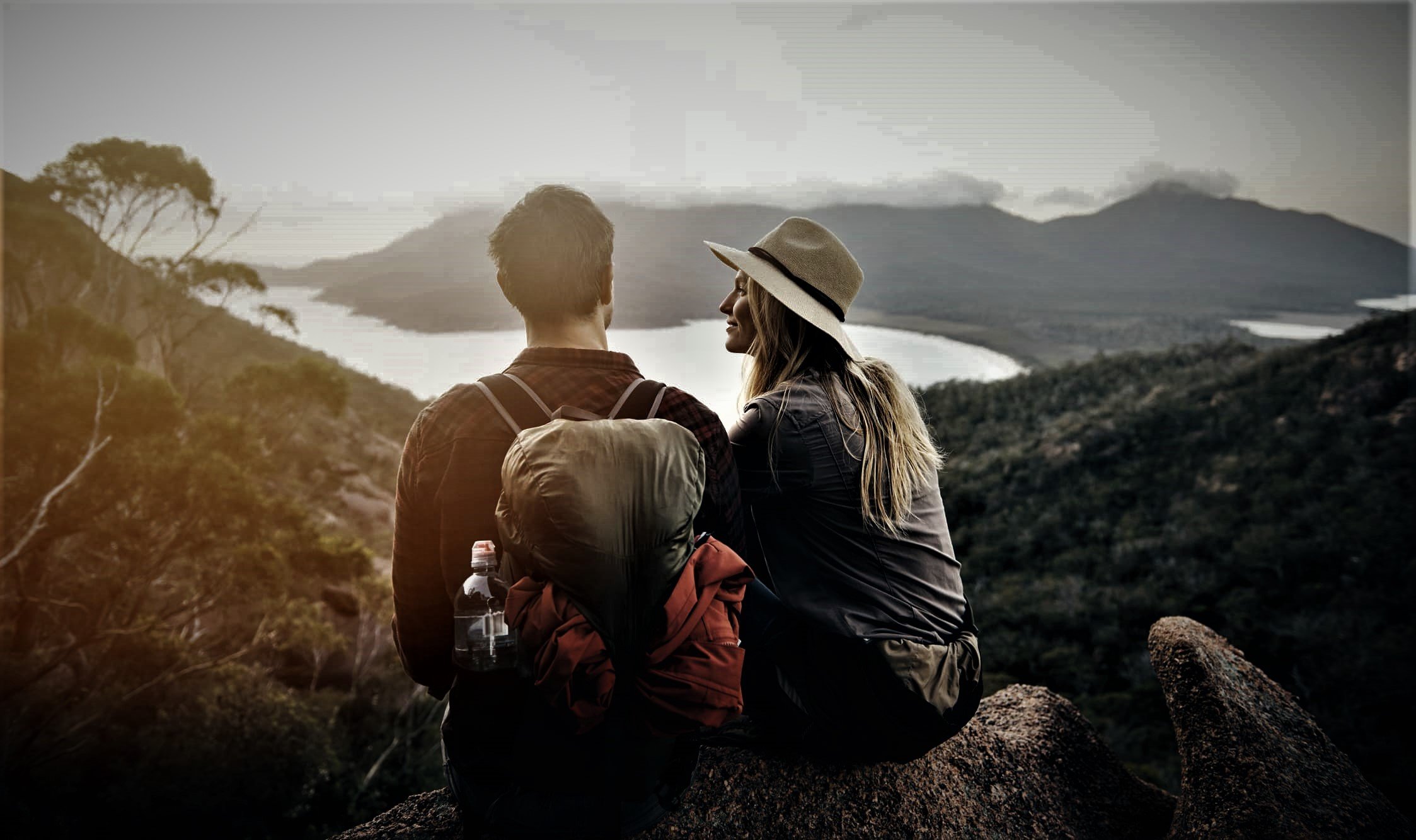 Travel nurse enjoying the view of mountains and water with their spouse. Travel nurse enjoying the view of mountains and water with their spouse.
