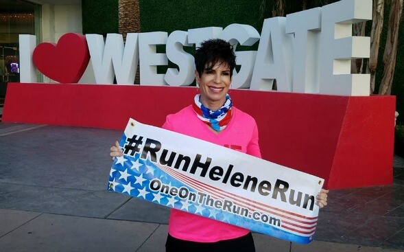 Helene Neville, runner and RN, with a banner Helene Neville, runner and RN, with a banner