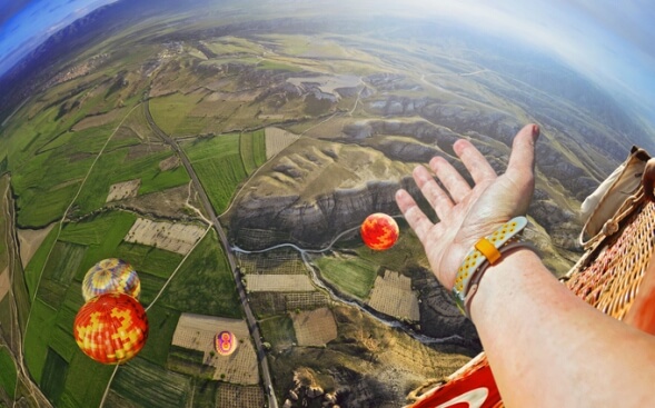 view of earth and other hot air balloons from a hot air balloon view of earth and other hot air balloons from a hot air balloon