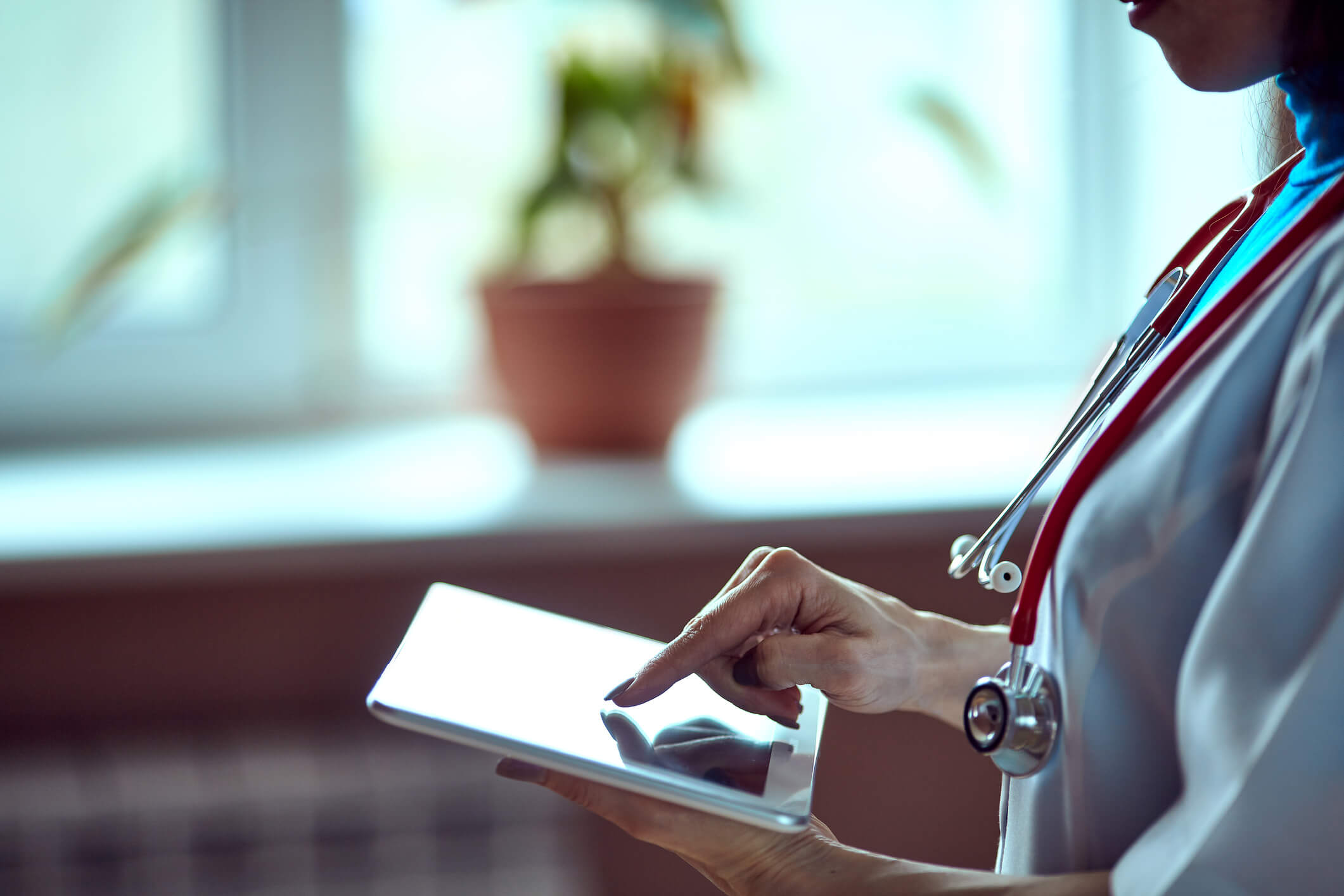 healthcare professional working on electronic tablet healthcare professional working on electronic tablet