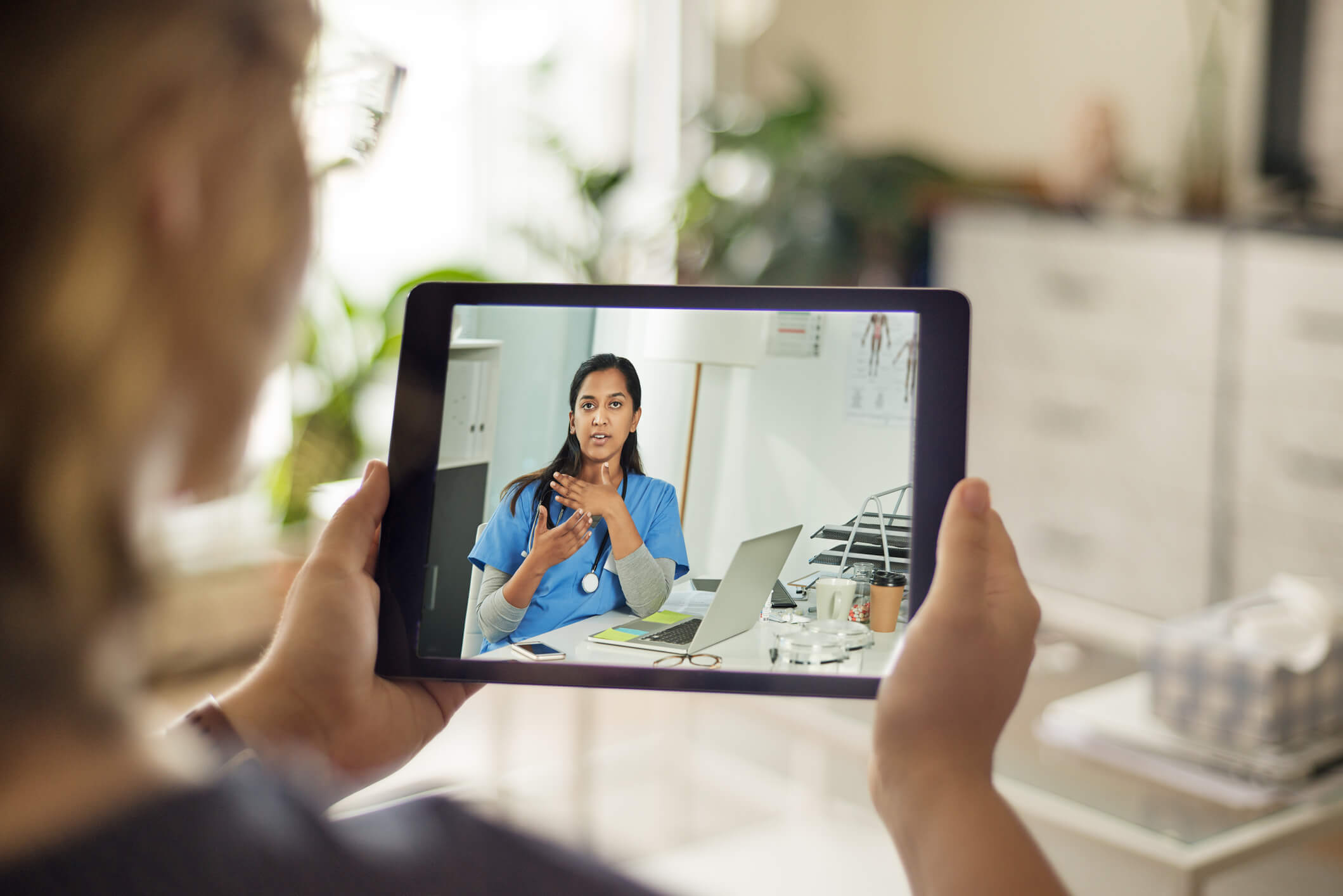 Patient talking to nurse on device Patient talking to nurse on device