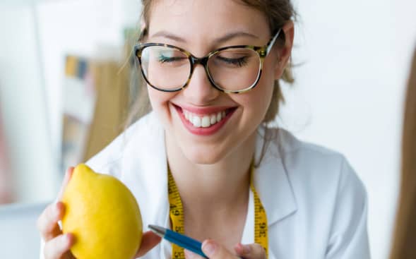 healthcare worker smiling at lemon healthcare worker smiling at lemon