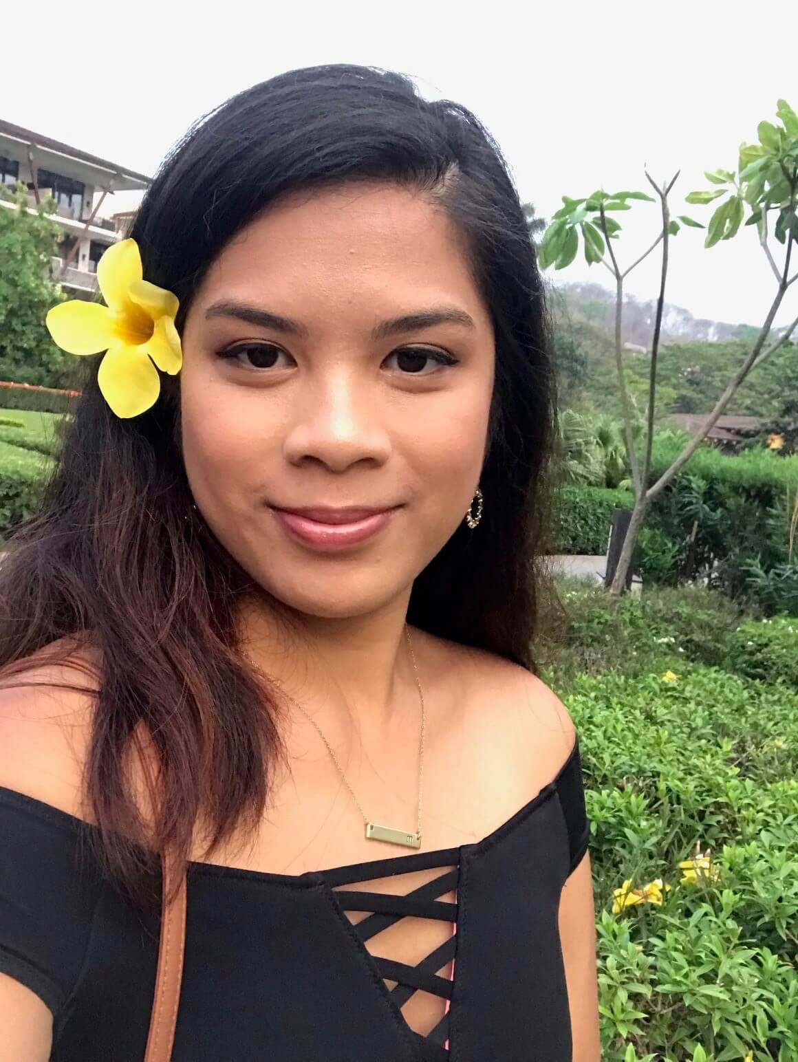 RN Marianne Juan close up with flower behind her ear RN Marianne Juan close up with flower behind her ear