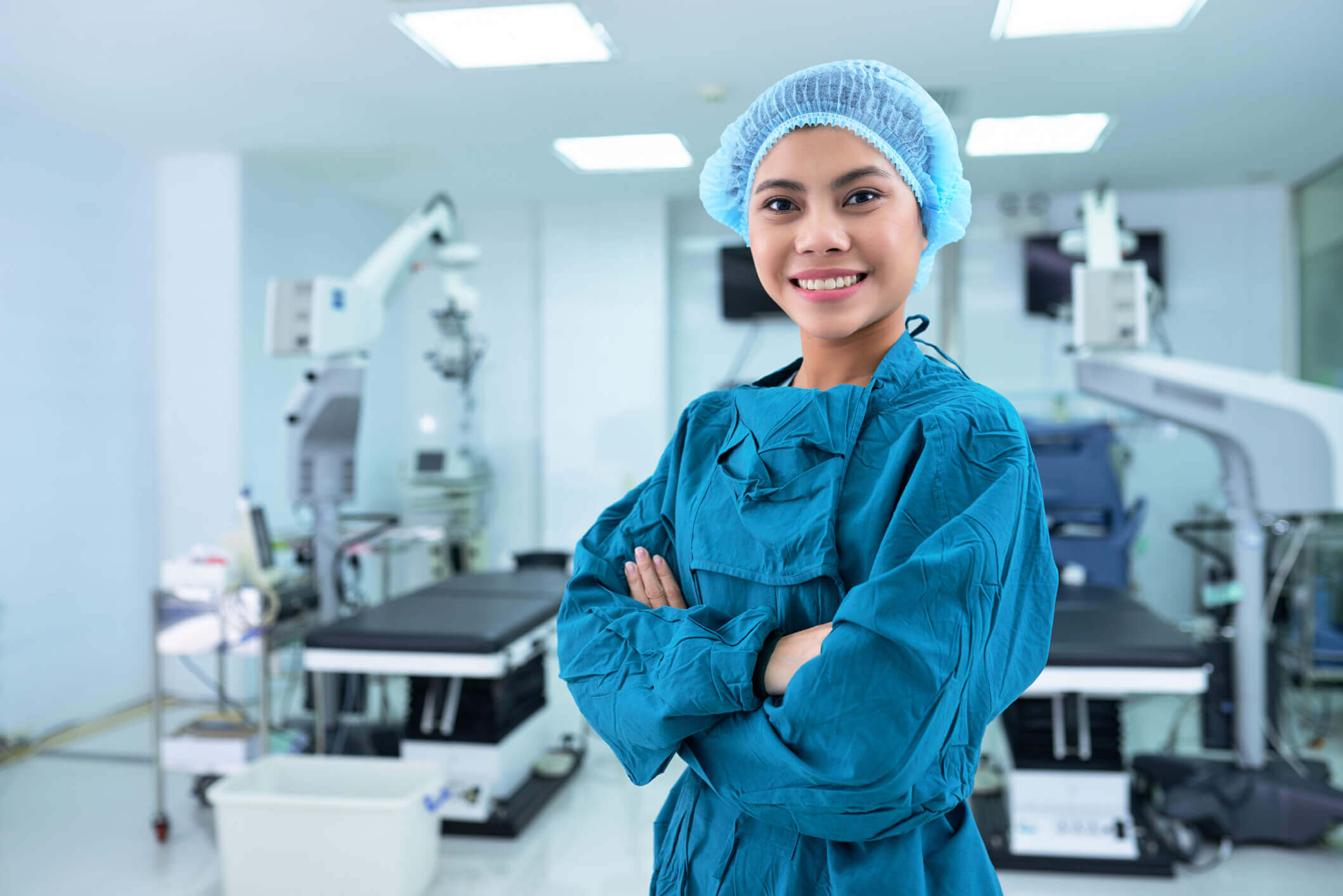 med-surg nurse standing in protective gear with arms crossed med-surg nurse standing in protective gear with arms crossed