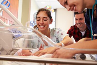nurse and new mother enjoying newborn baby nurse and new mother enjoying newborn baby