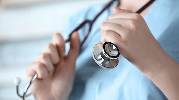 nurse holding stethoscope nurse holding stethoscope