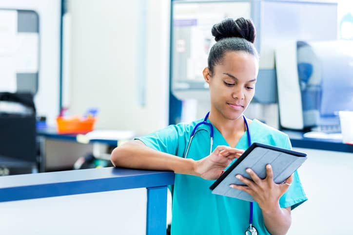 Nurse looking up medical records Nurse looking up medical records