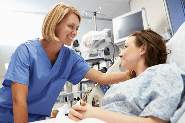 Nurse Smiling at Patient Nurse Smiling at Patient