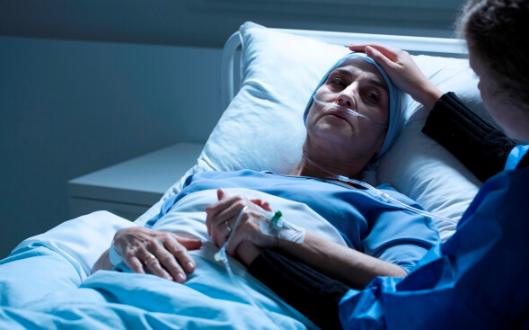 woman comforting cancer patient woman comforting cancer patient