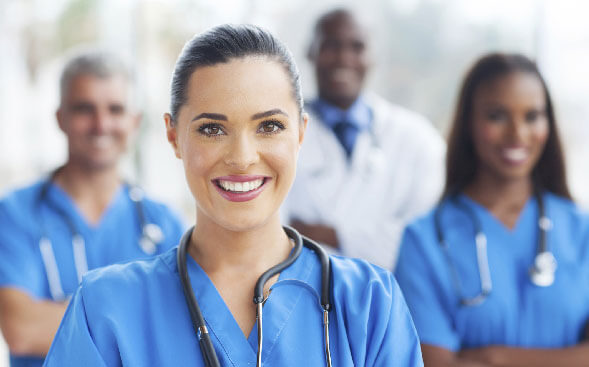 Group of nurses with one close up in front Group of nurses with one close up in front