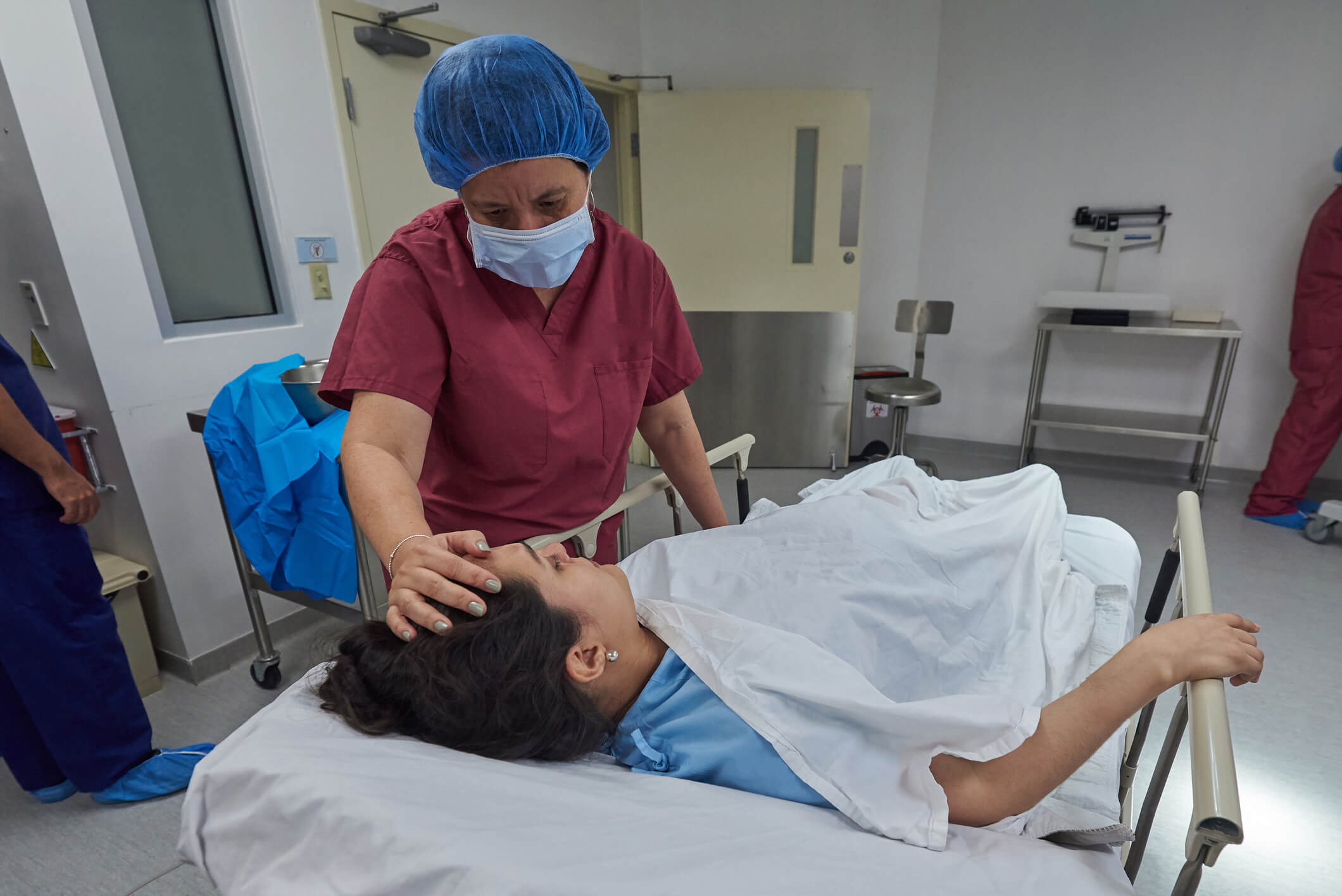 nurse comforting patient post surgery nurse comforting patient post surgery