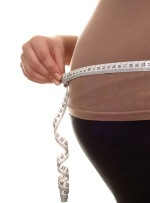 measuring tape around stomach measuring tape around stomach