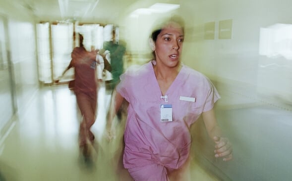 nurse running in hall shown by slightly blurred image nurse running in hall shown by slightly blurred image