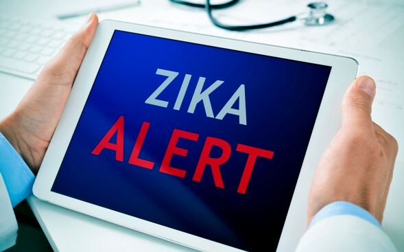 Zika Alert written on displayed electronic tablet Zika Alert written on displayed electronic tablet