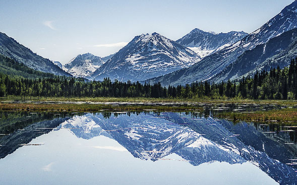 mountains surrounding a lake mountains surrounding a lake
