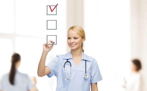 nurse putting checkmarks on list on clear wall nurse putting checkmarks on list on clear wall
