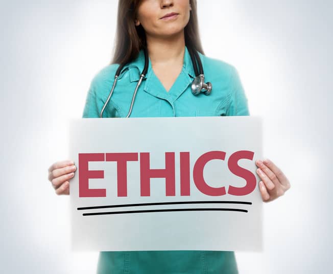 Nurse Holding Ethics Sign Nurse Holding Ethics Sign
