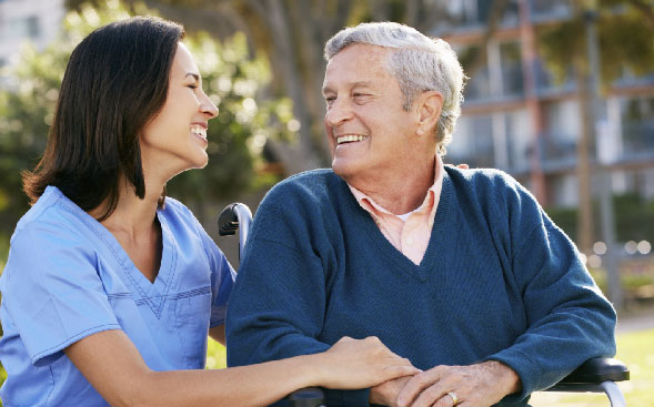 nurse and senior patient touching and smiling at each other nurse and senior patient touching and smiling at each other