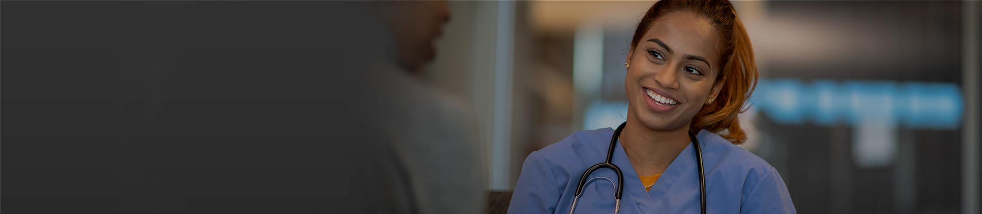 Nurse smiling in hospital setting