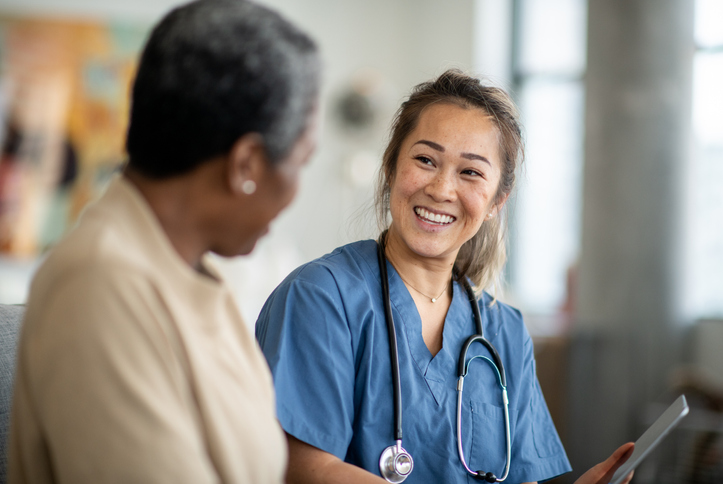 Home health nurse smiling at a patient Home health nurse smiling at a patient
