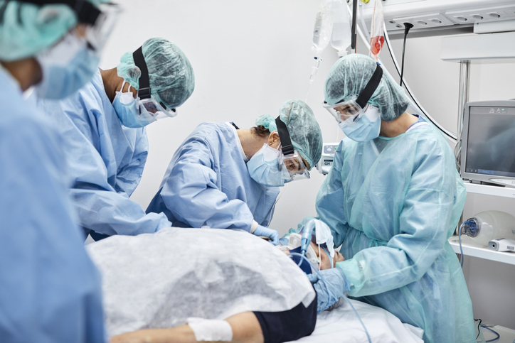 ICU nurses working on a patient ICU nurses working on a patient